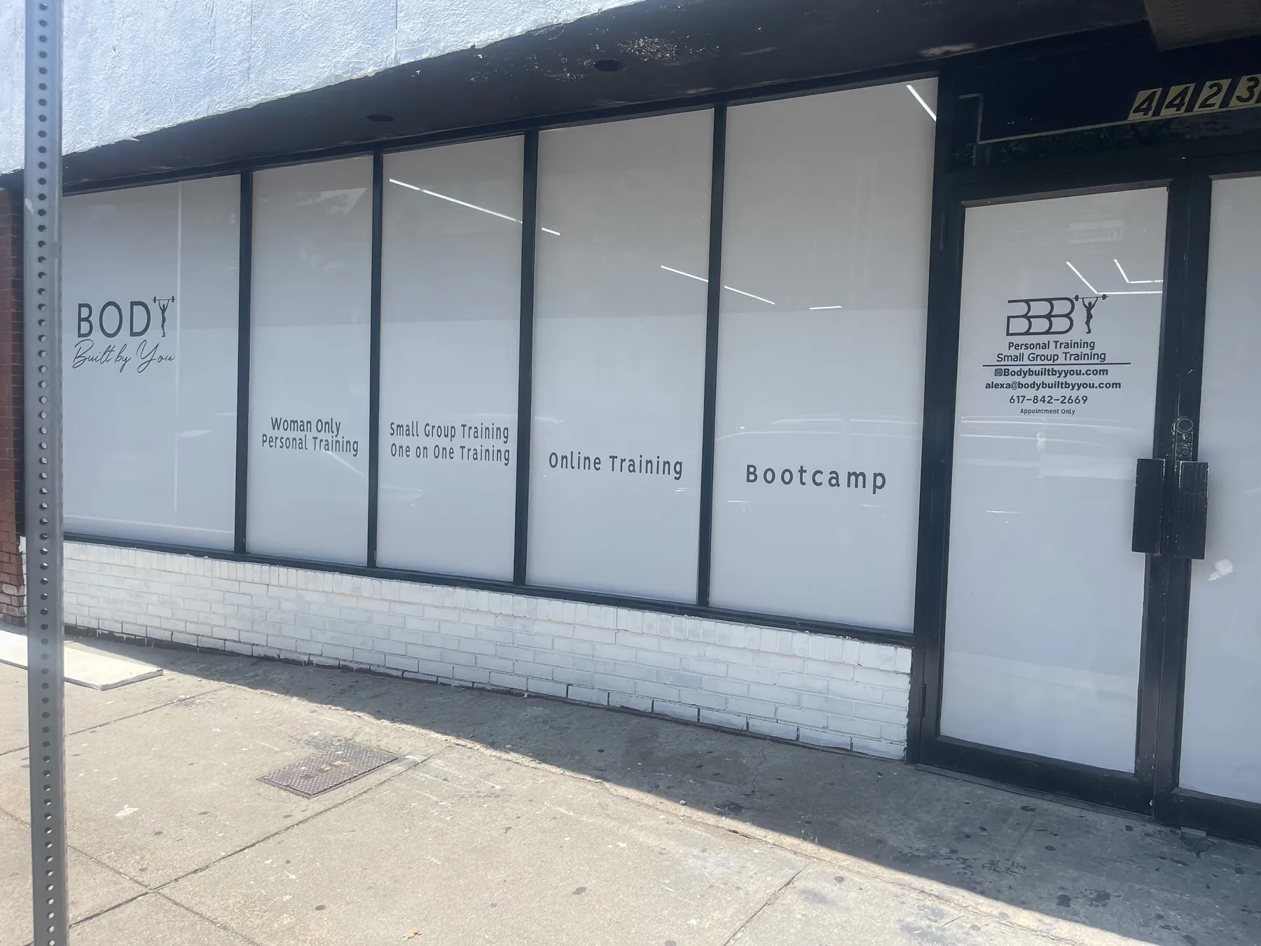 The Body Built By You storefront on Washington St, white windows with black lettering